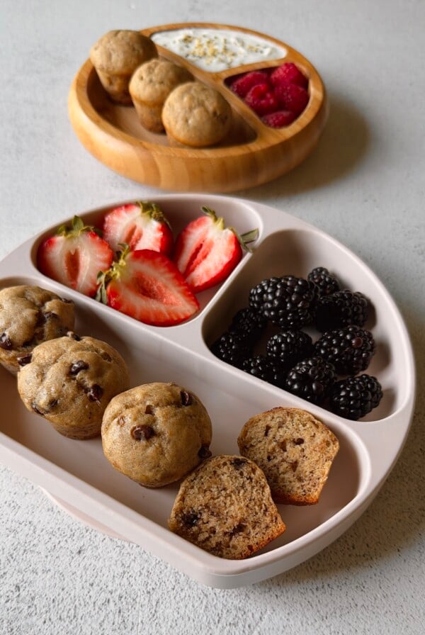 Eggless banana muffins served with berries and yogurt.