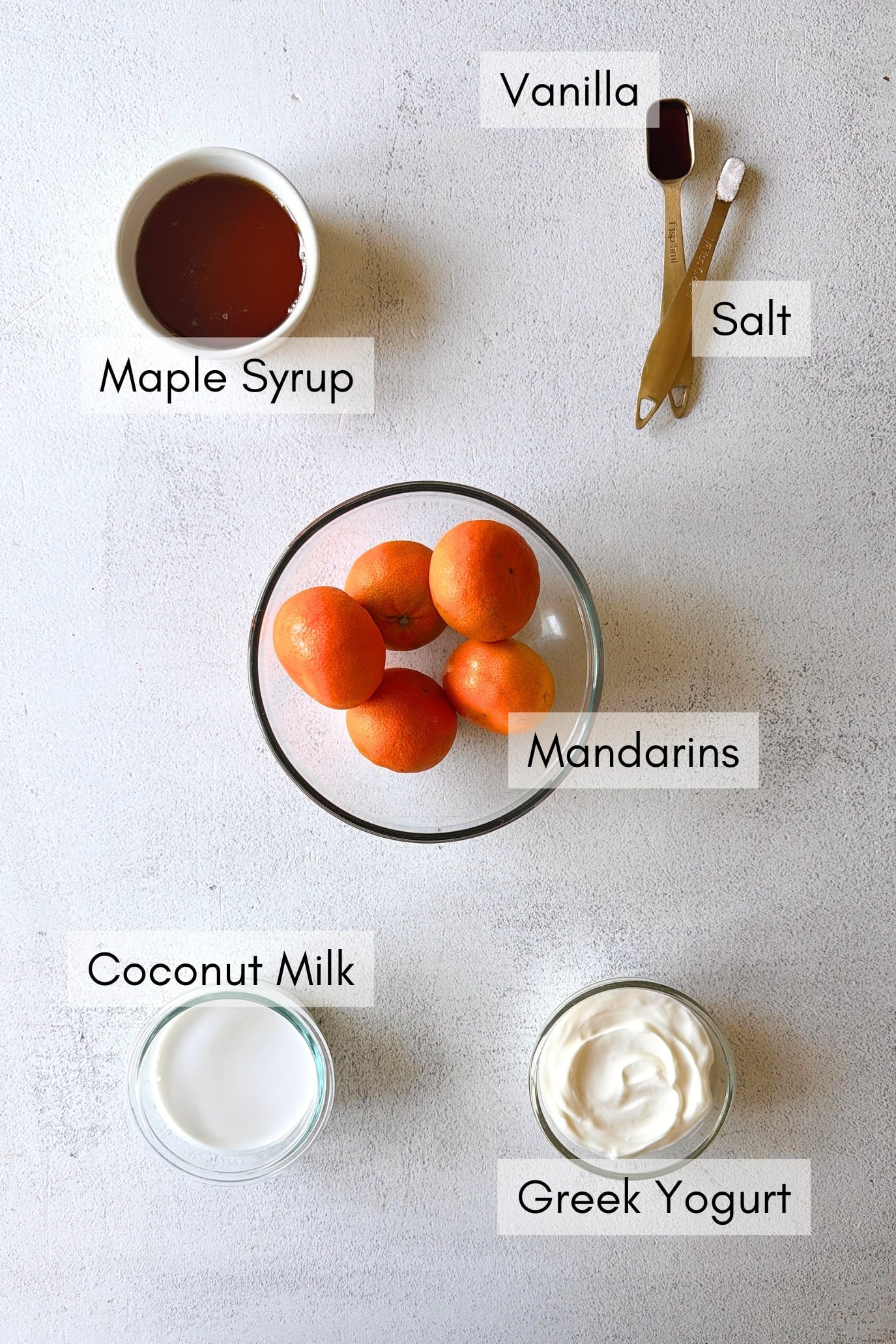 Ingredients to make homemade orange creamsicle popsicles.