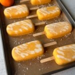 Homemade orange creamsicle popsicles.