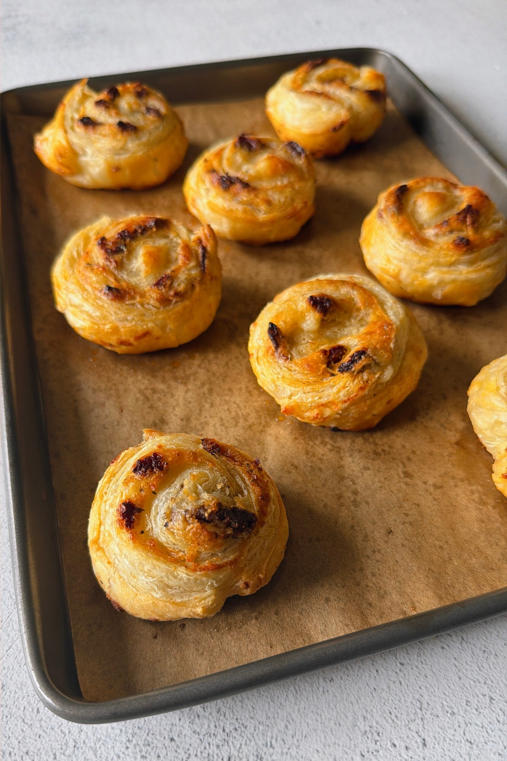 Cheese and tomato pinwheels served with broccoli and strawberries.