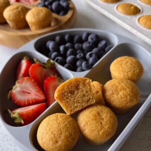 Sweet potato corn muffins served with berries.