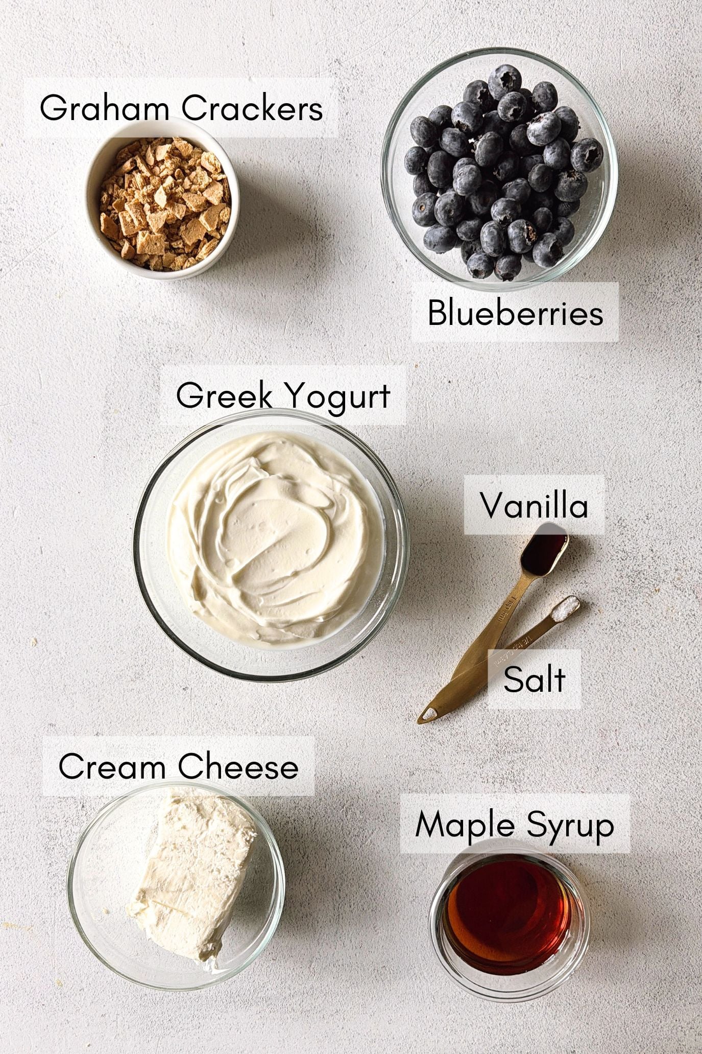 Ingredients to make blueberry cheesecake popsicles.