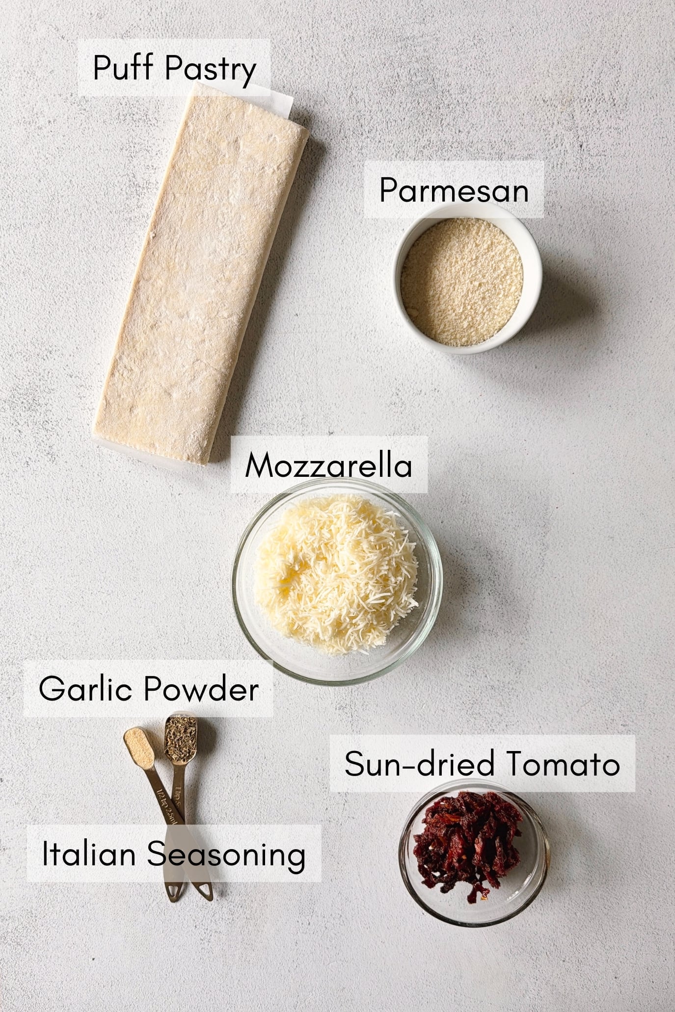 Ingredients to make cheese and tomato pinwheels.