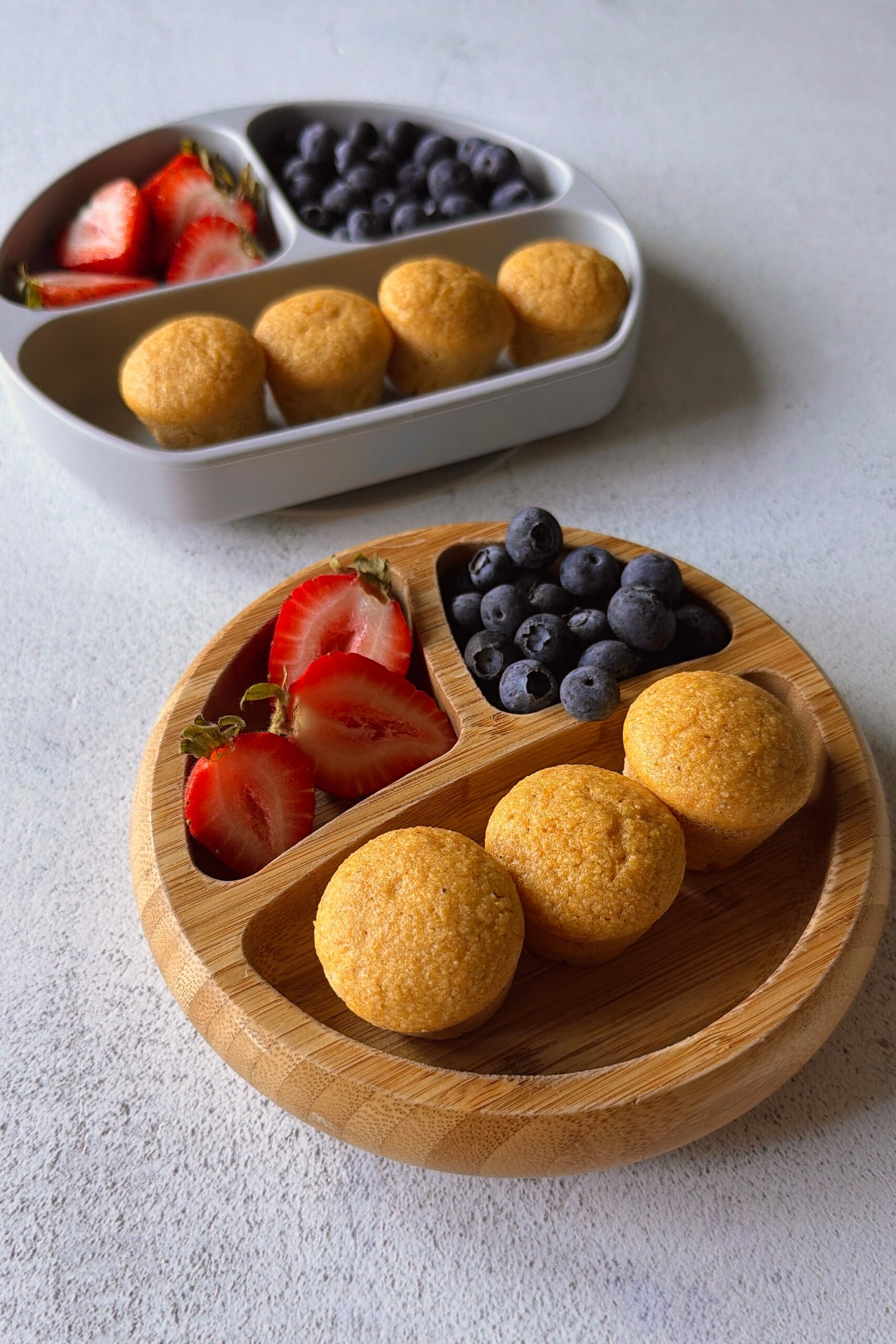 Sweet potato corn muffins served with berries.