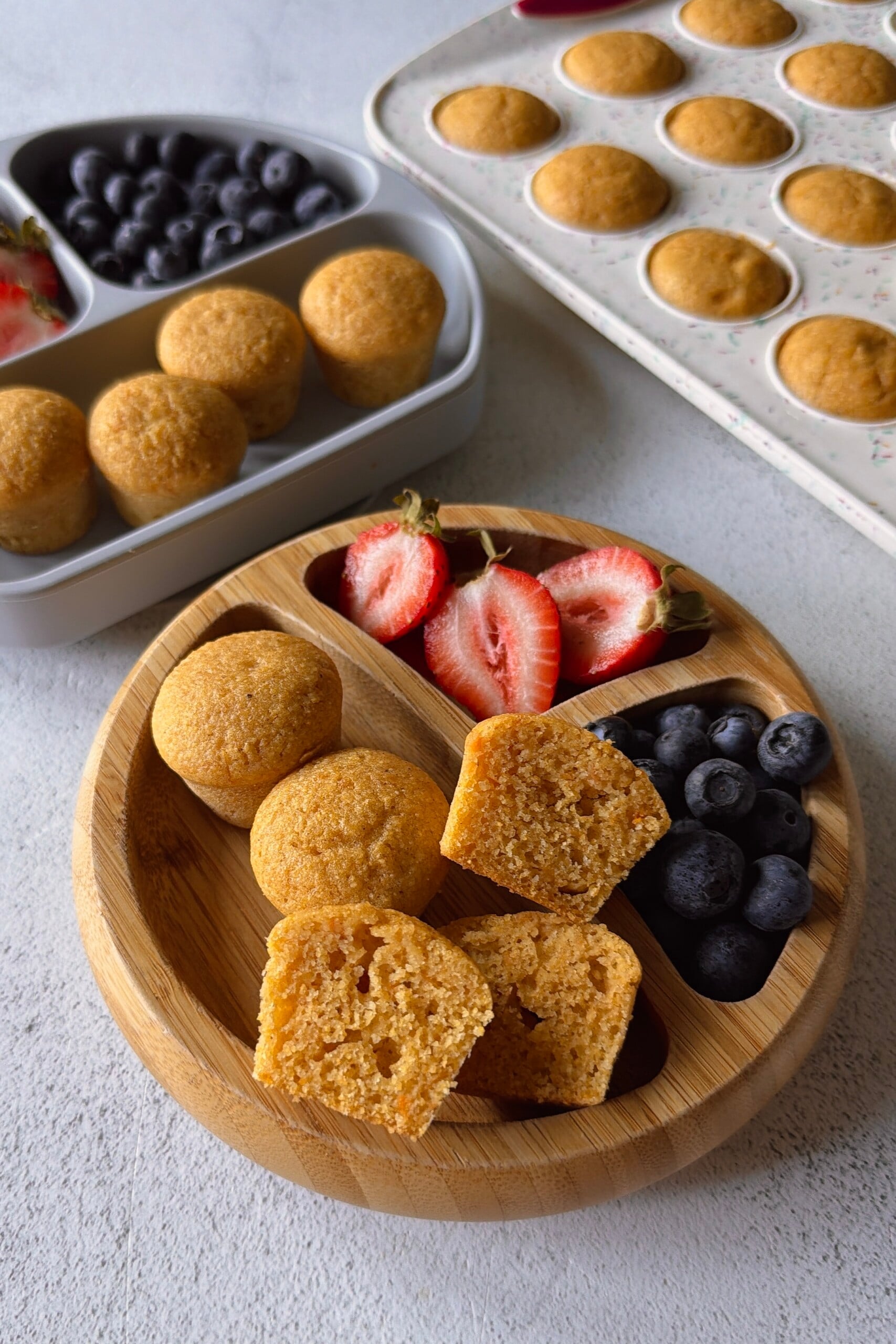 Sweet potato corn muffins served with berries.