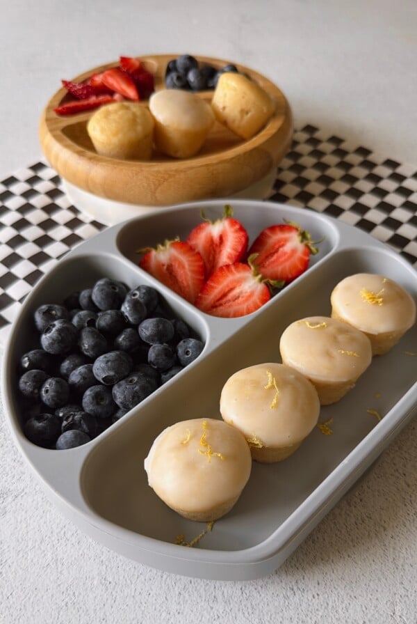 Mini lemon muffins served with berries.