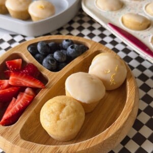 Mini lemon muffins served with berries.