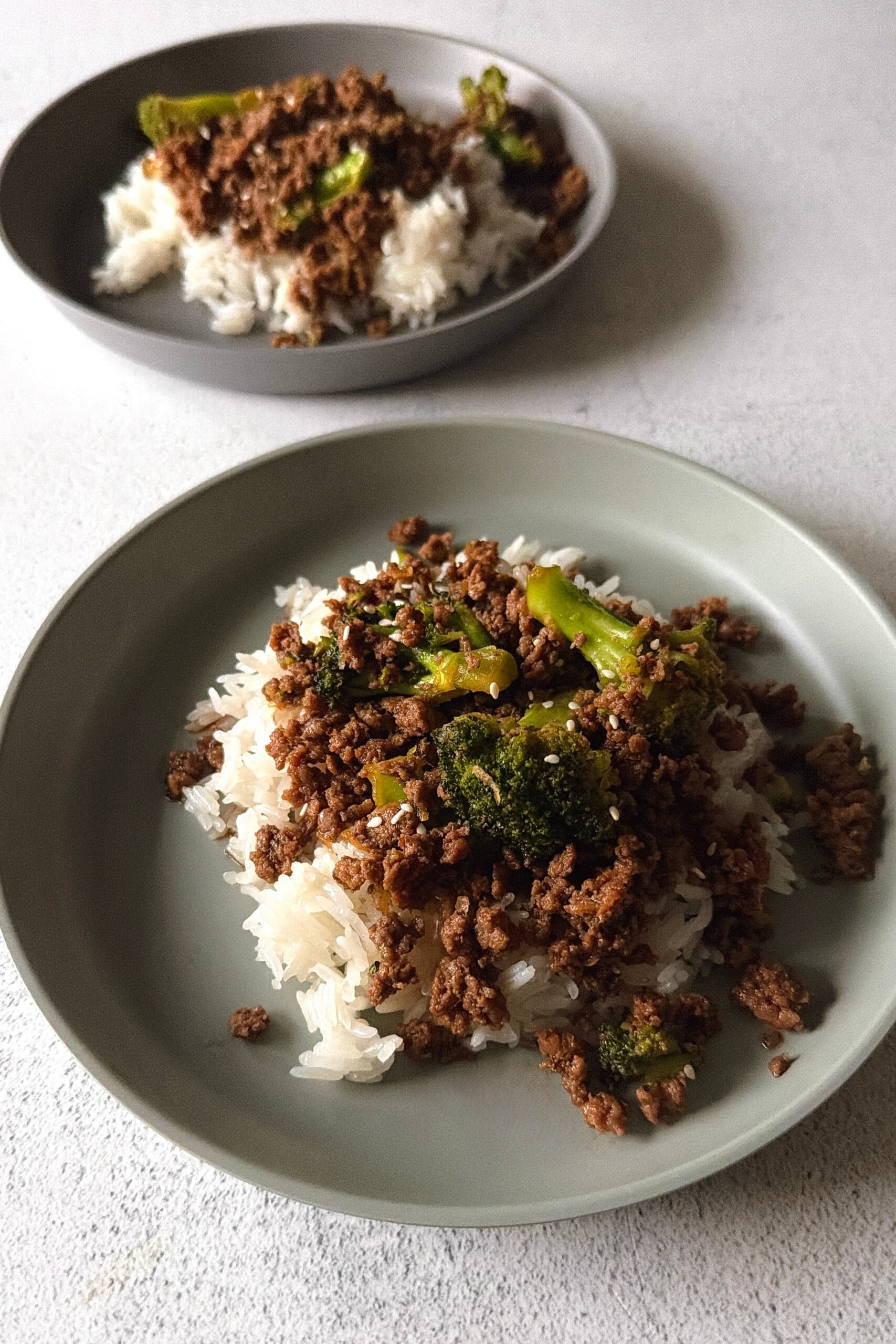 Ground beef and broccoli stir fry served with white rice.