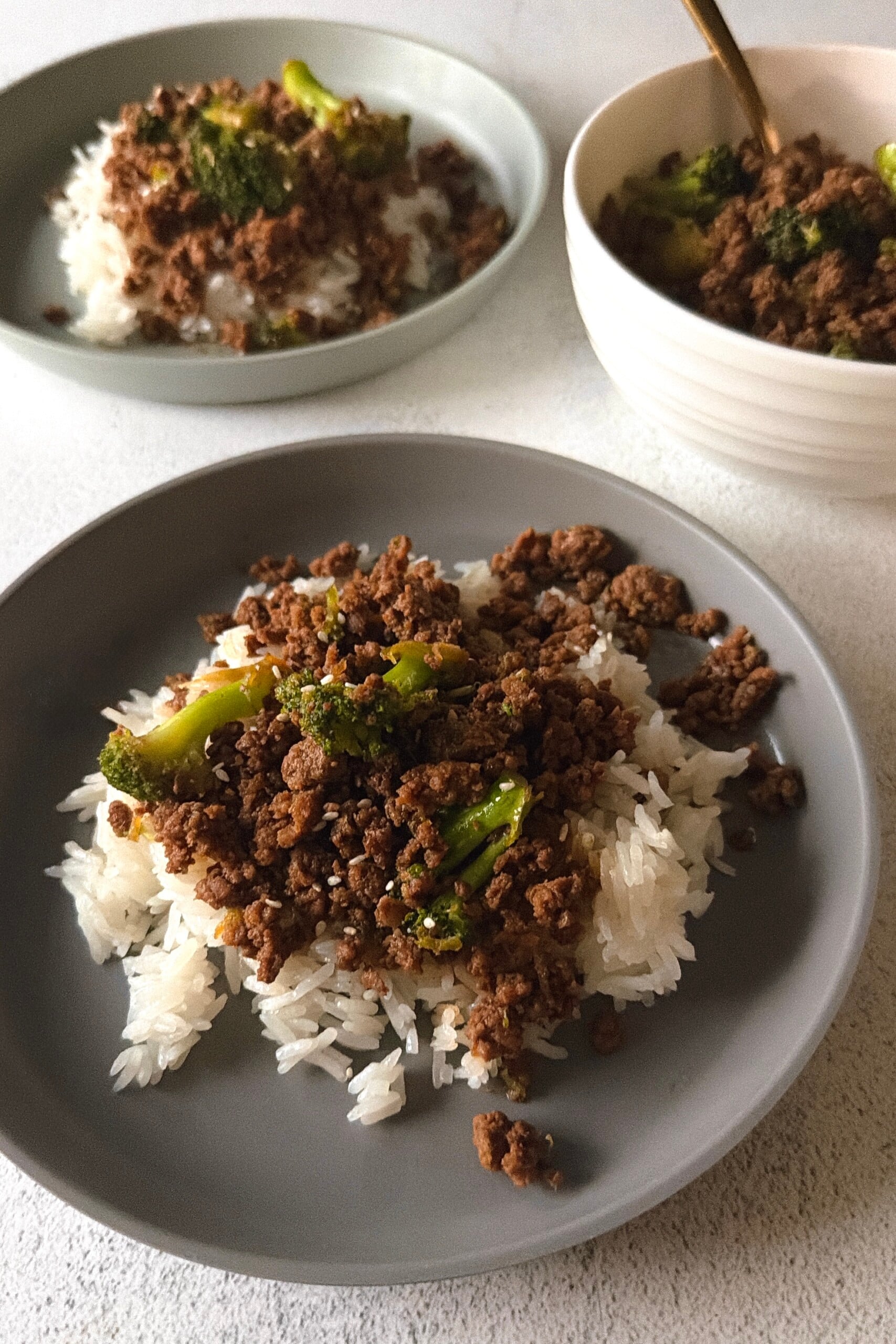 Ground beef and broccoli stir fry served with white rice.
