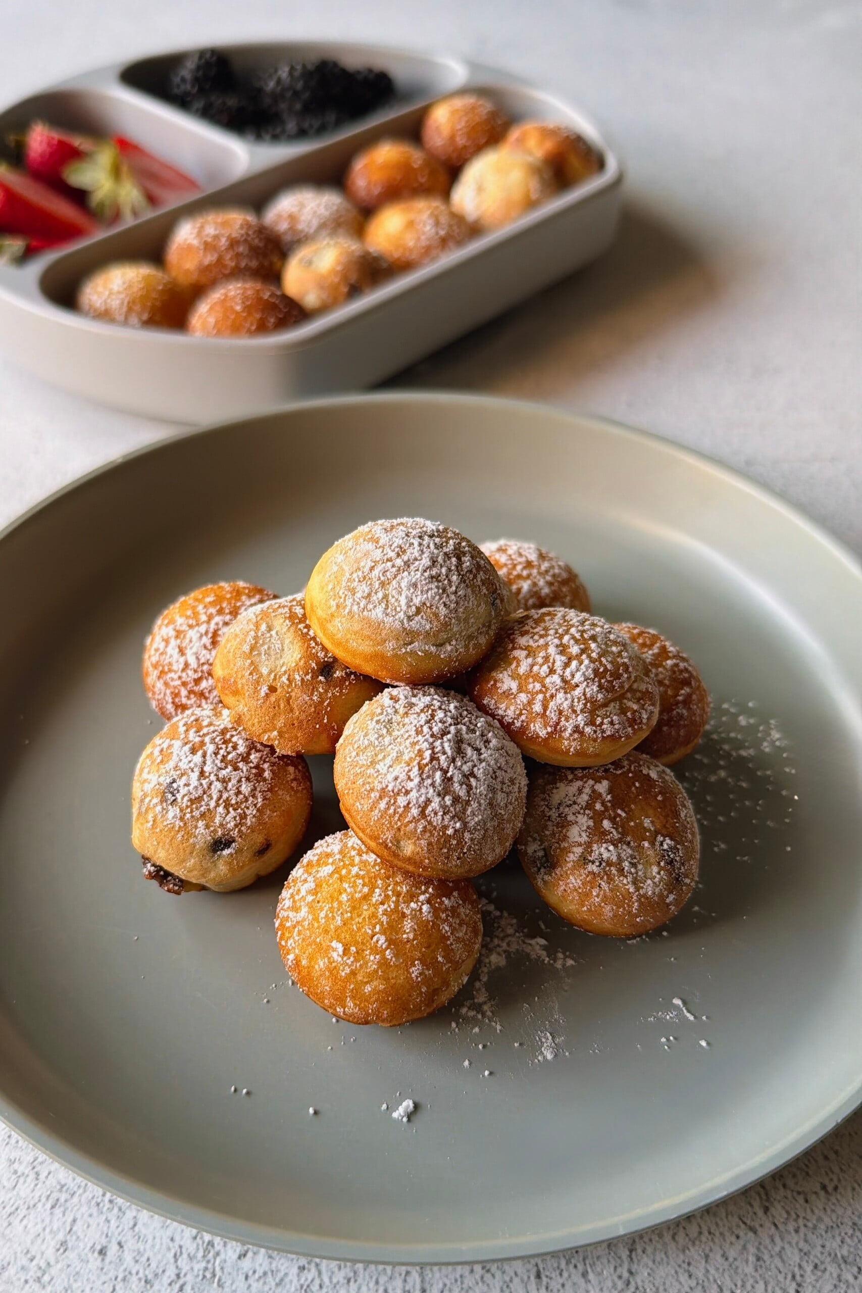 Pancake puffs served with berries.