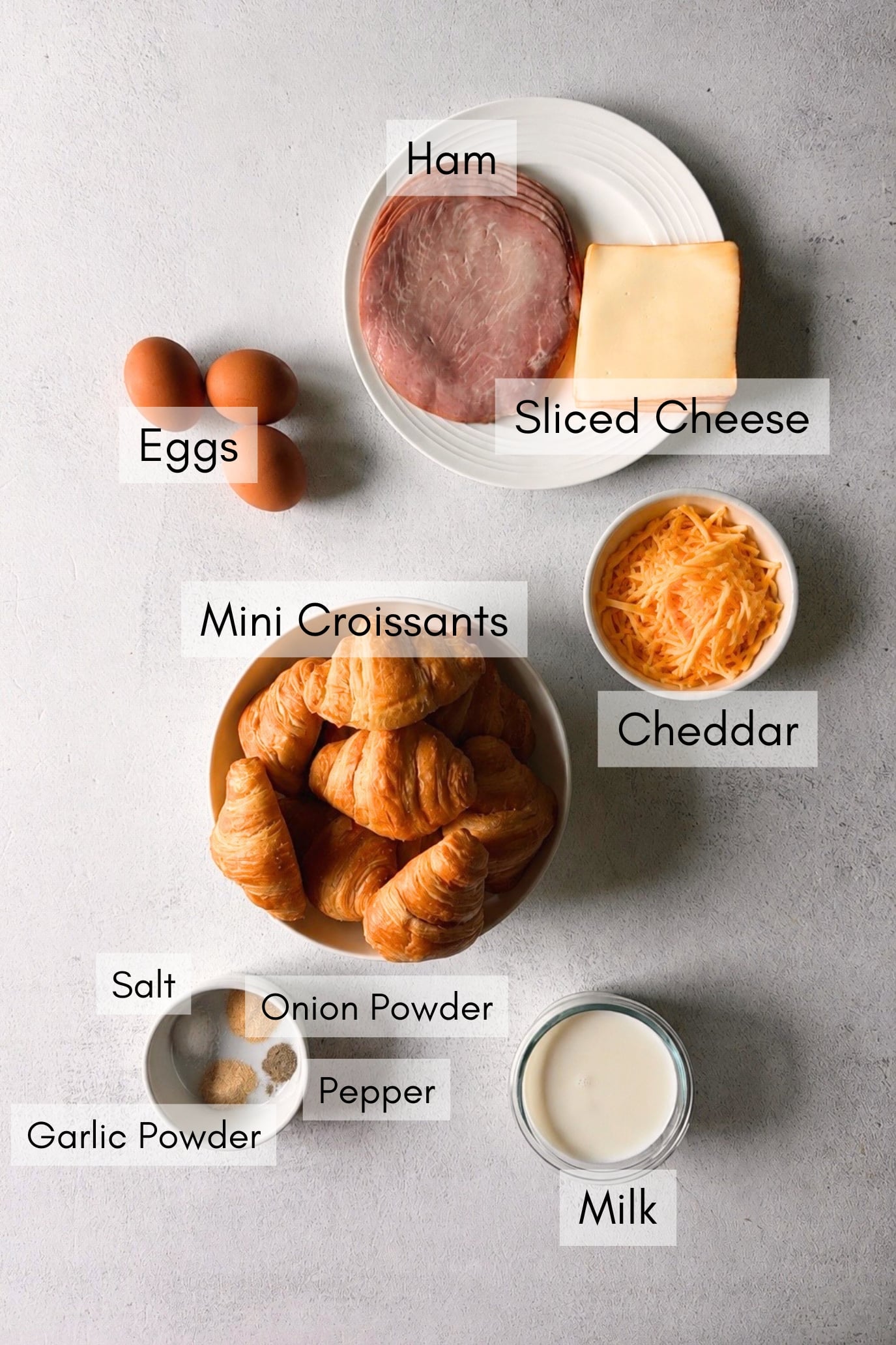 Ingredients to make baked ham and cheese croissants.
