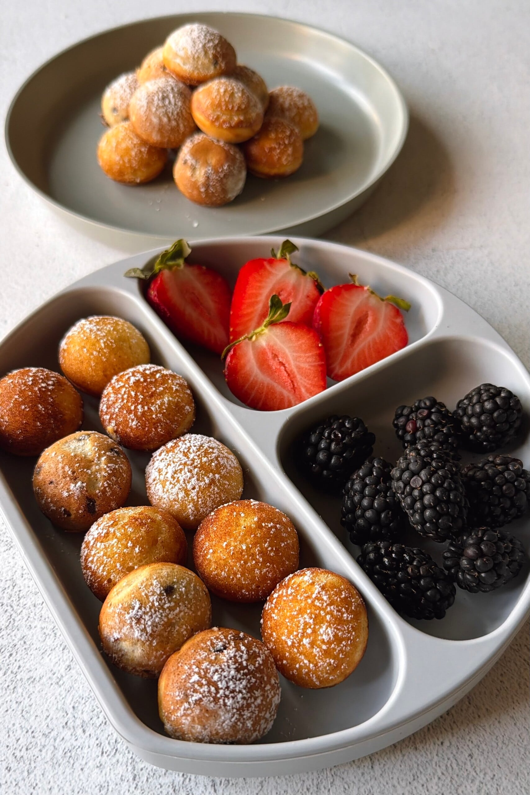 Pancake puffs served with berries.