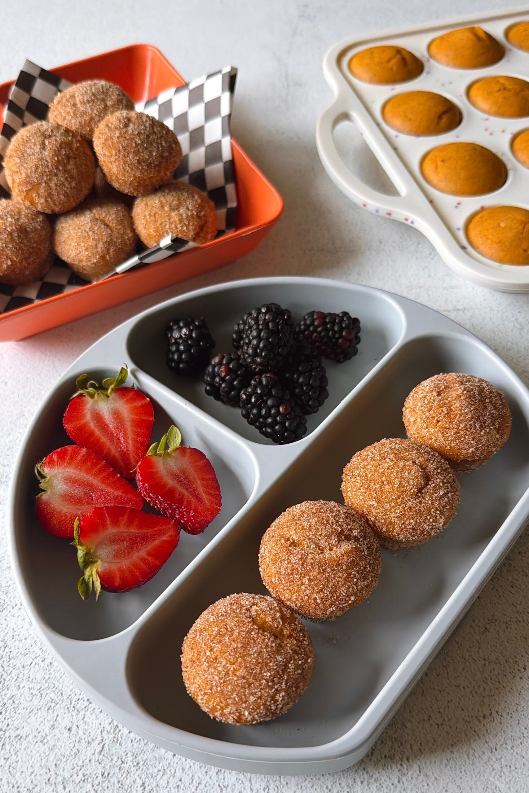 Pumpkin maple muffins served with berries.