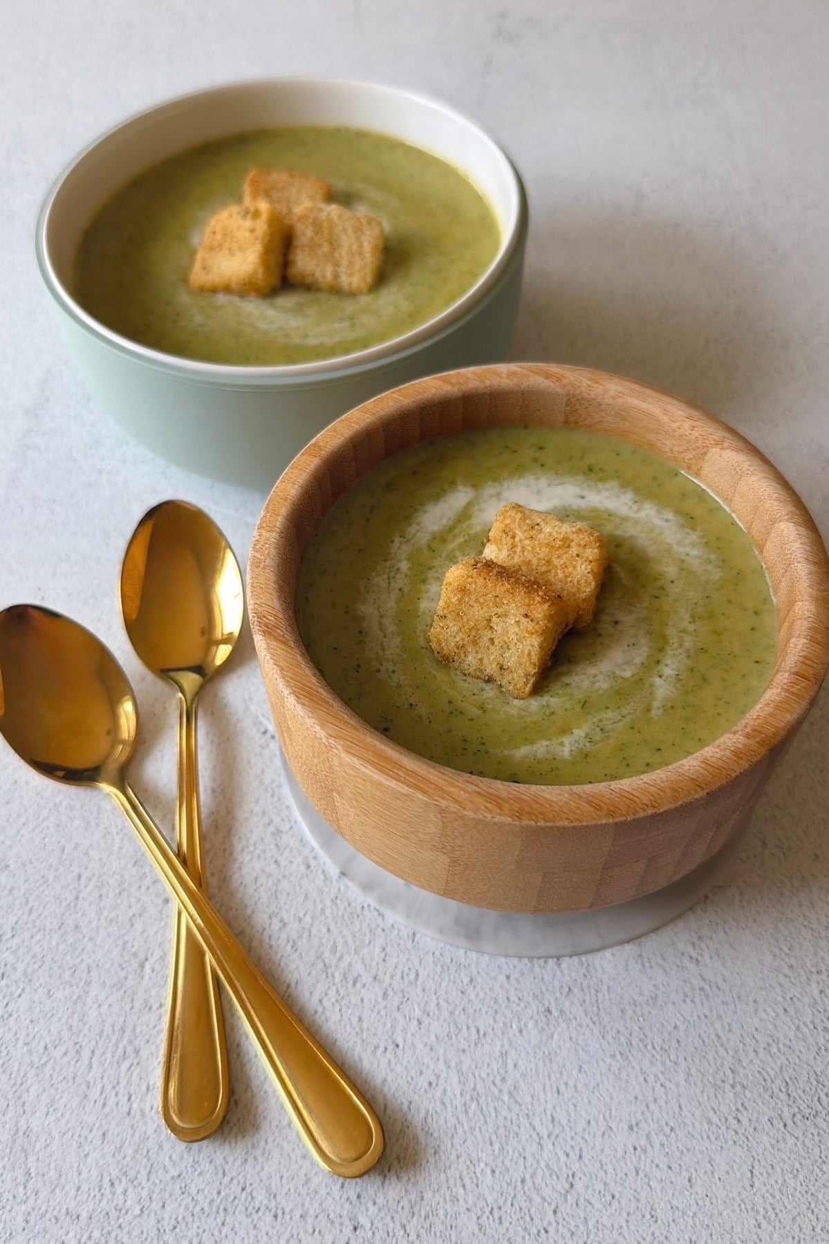 Broccolini soup served with croutons.