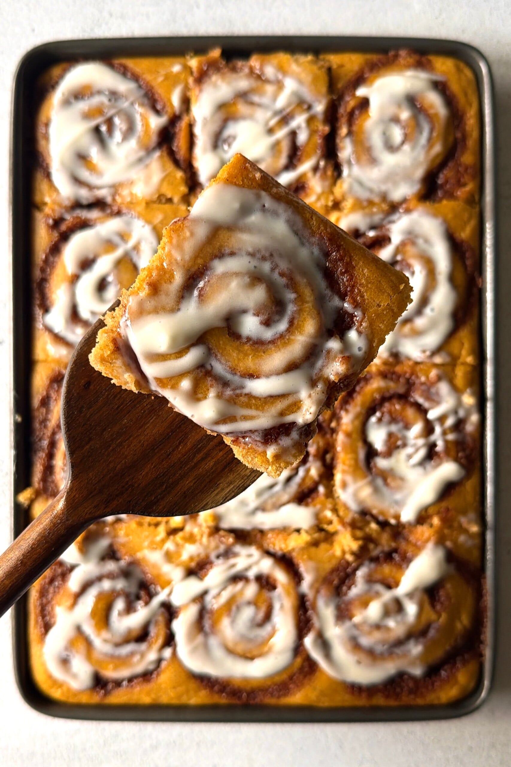 Pumpkin cinnamon roll sheet pan pancakes.