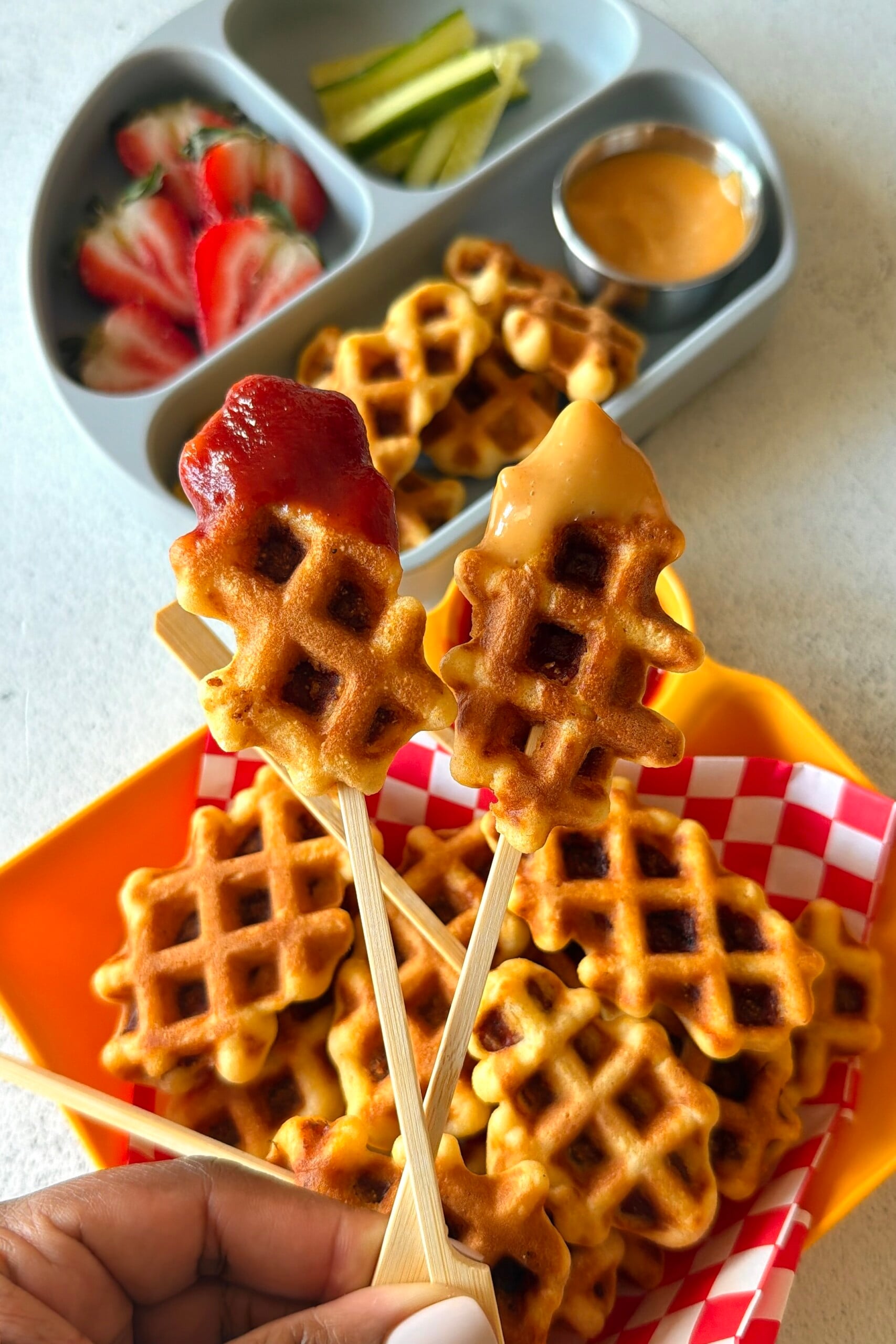 Corn dog waffles served with ketchup.