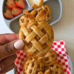 Mini apple pies served with strawberries and yogurt.