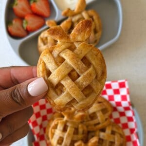 Mini apple pies served with strawberries and yogurt.
