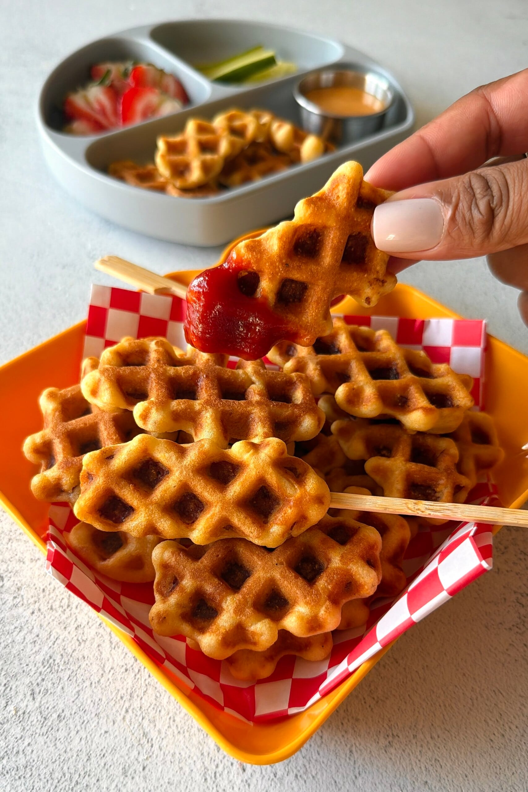 Corn dog waffles served with ketchup.