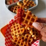 Mozzarella stick waffles served with marinara sauce.